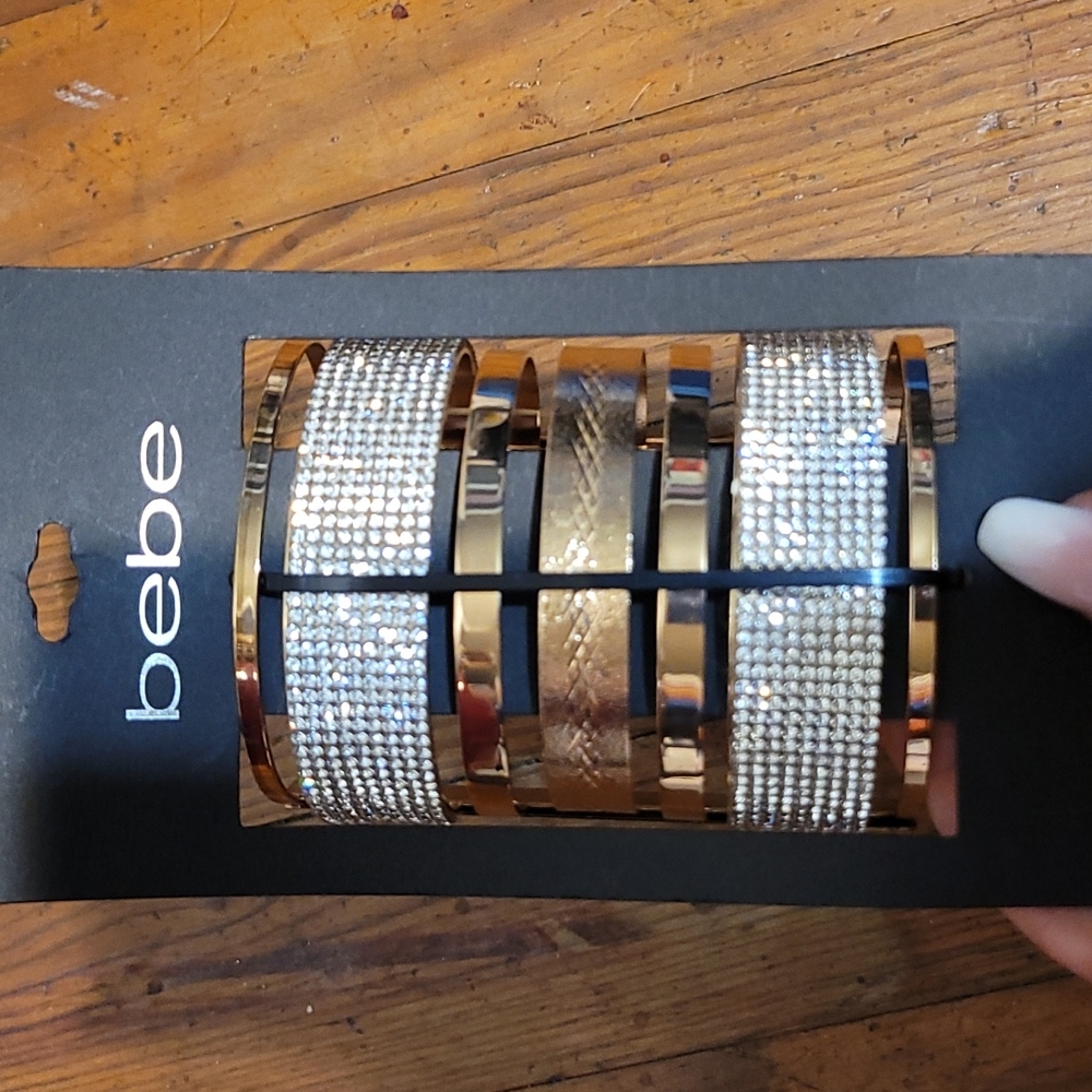 BEBE Gold cuff bracelet with cubic zirconi on it